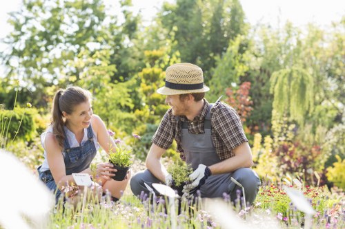 Gardener pruning shrubs in Hackney